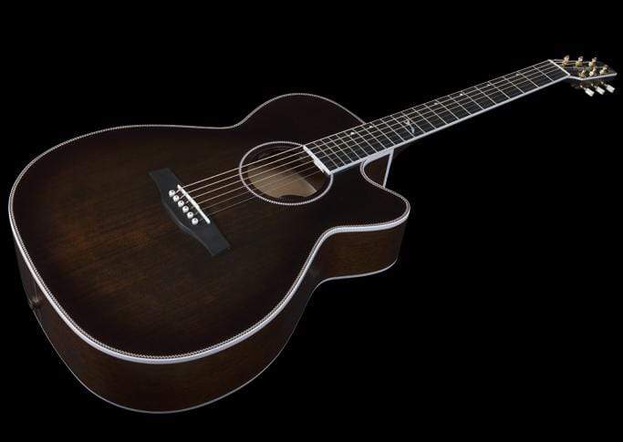 A Seagull Artist Mosaic CH CW Acoustic-Electric Guitar in Bourbon Burst, with cutaway body and white edging, is shown against a black background.