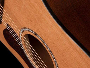 Seagull S6 Original Acoustic Guitar close-up, highlighting its strings and cedar top, known for quality sound and craftsmanship.