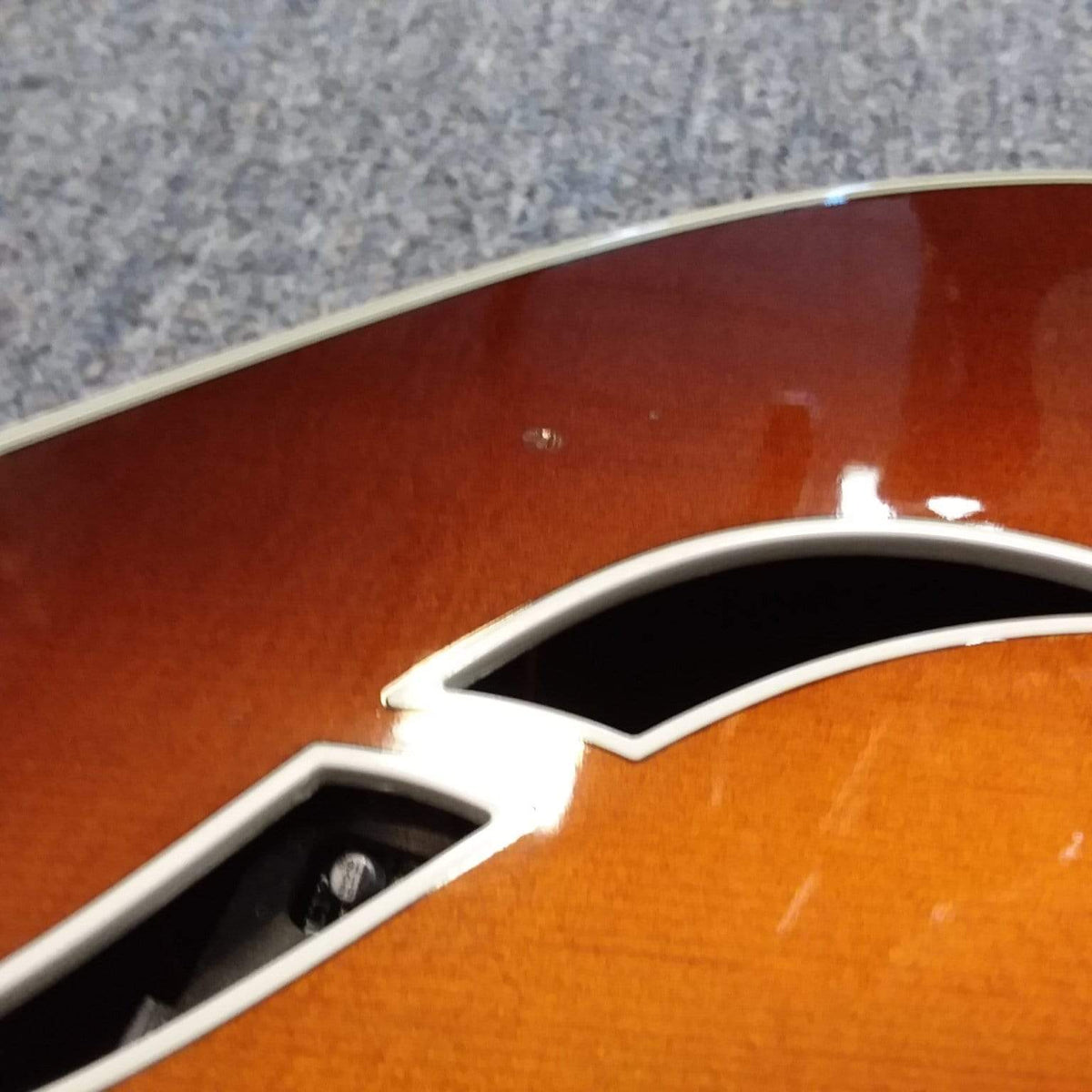 Taylor T5-C 2006 guitar with custom Fishman Matrix Piezo pickup, close-up showing strings and body detail.