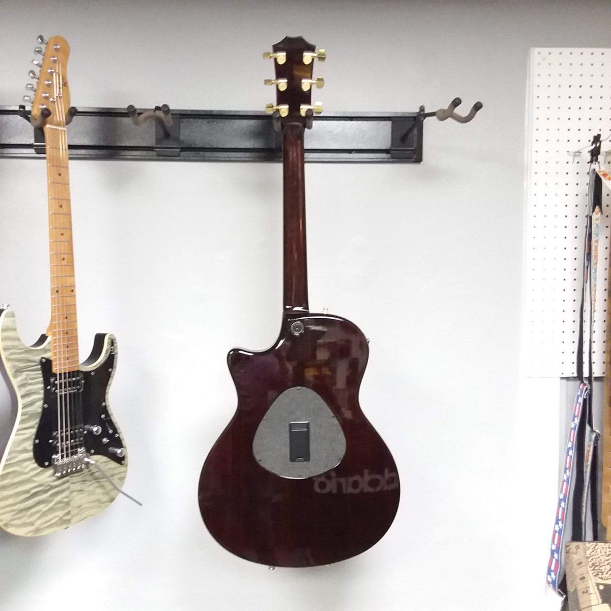 Taylor T5-C 2006 guitar with Custom Fishman Matrix Piezo, displayed on a wall; includes case and setup by senior technician.