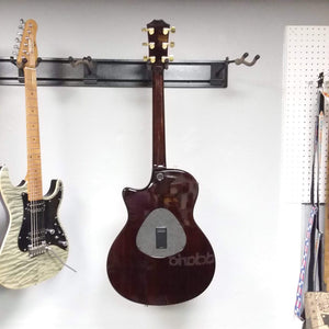 Taylor T5-C 2006 guitar with Custom Fishman Matrix Piezo, displayed on a wall; includes case and setup by senior technician.