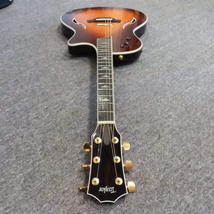 Taylor T5-C 2006 guitar with Custom Fishman Matrix Piezo, lying on the floor, showing wear and grooving on lower frets. Comes with a case.