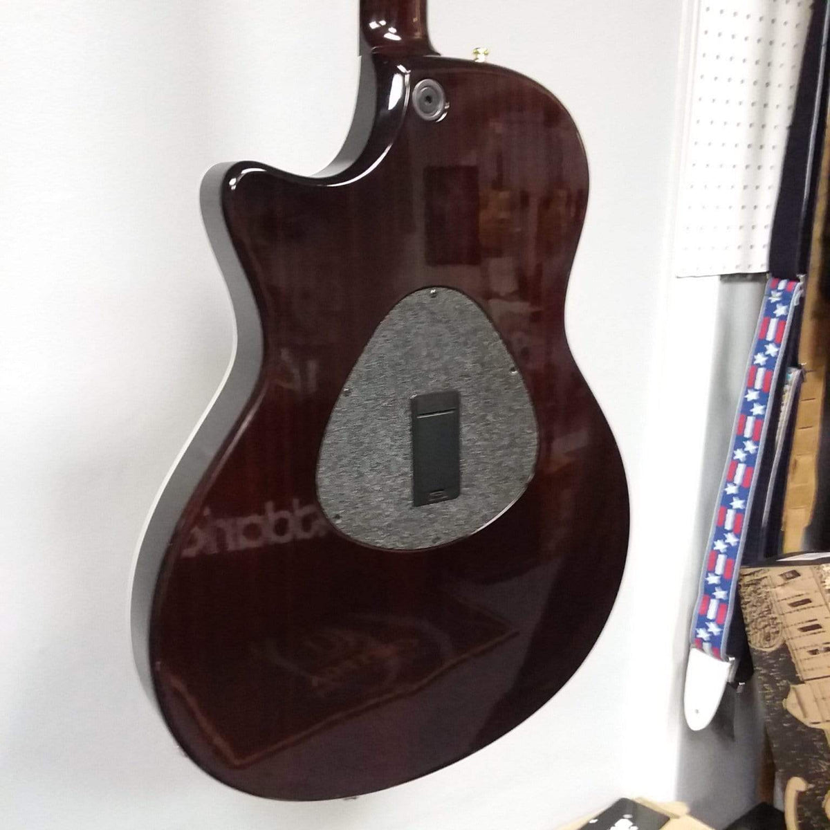 Taylor T5-C 2006 guitar with Custom Fishman Matrix Piezo, displayed on a wall.