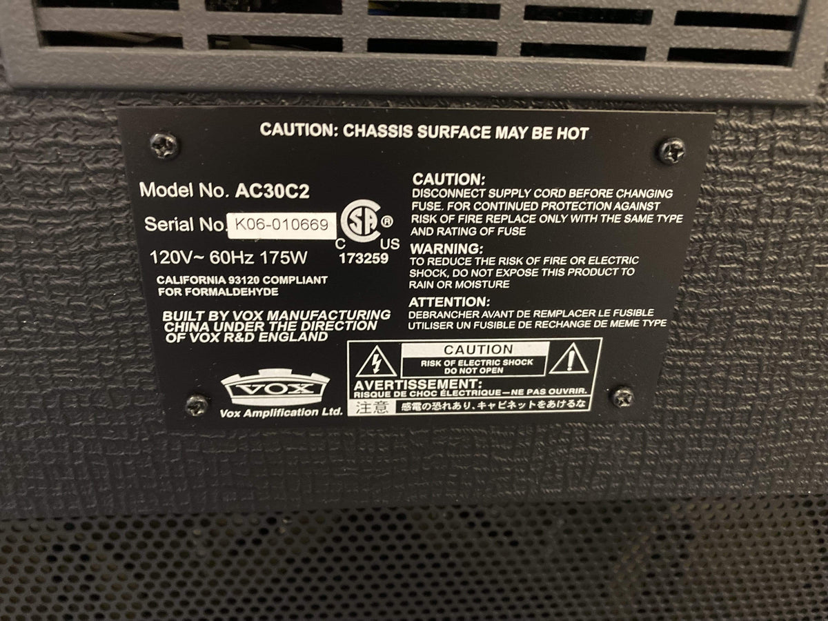 Vox AC30C2 amplifier with black and white label, featuring dual 12” Celestion speakers, known for its powerful tone and iconic British Invasion sound.