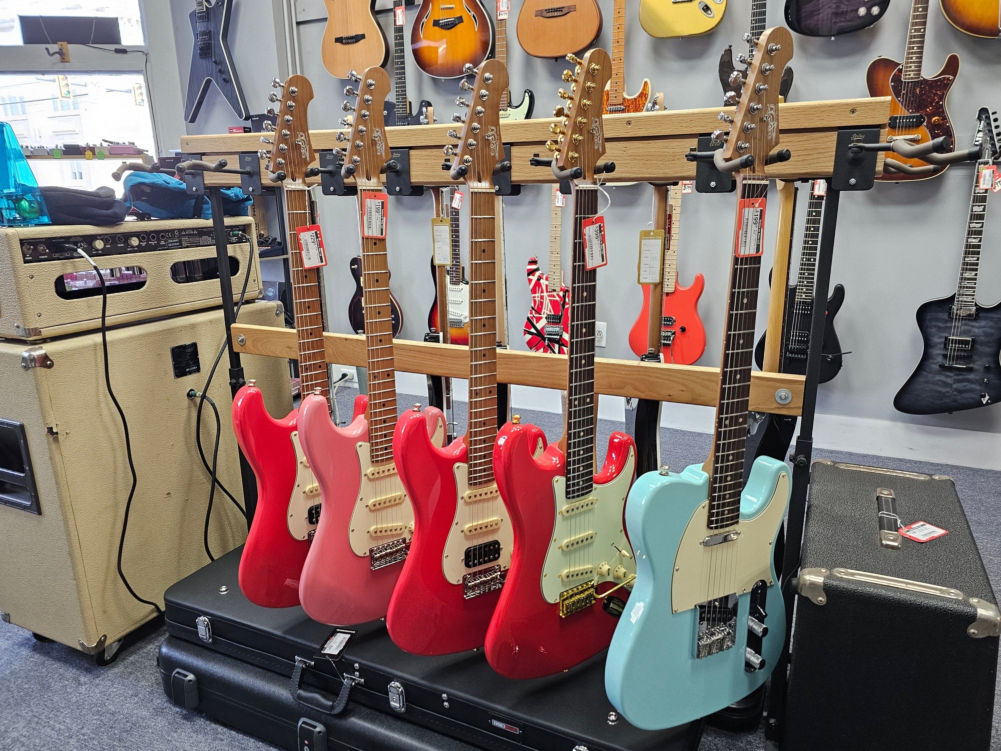 Jet guitars on a rack in showroom.