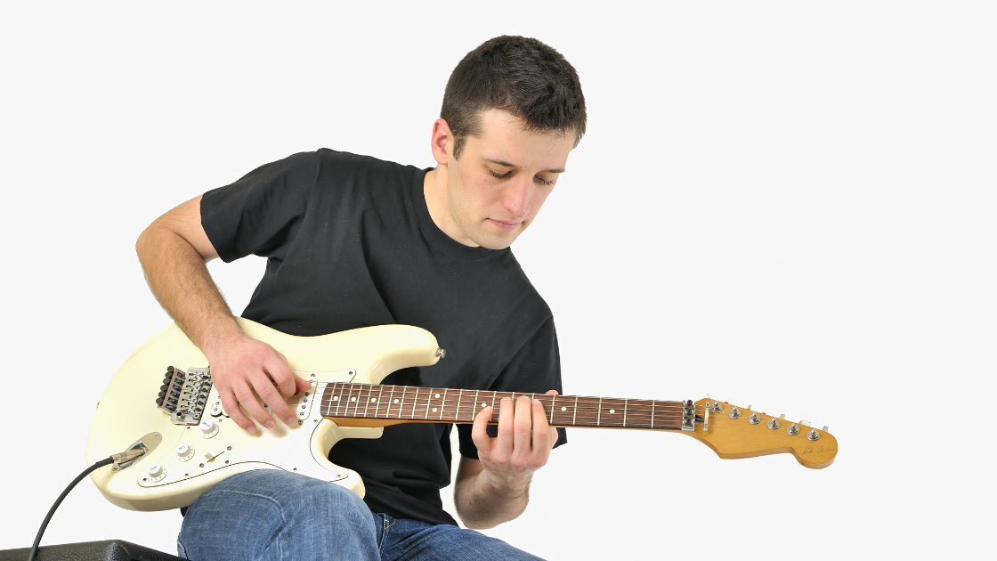 Young boy playing guitar
