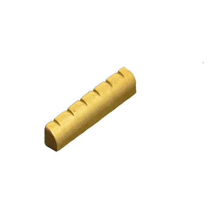 A replacement guitar nut for a Les Paul from Allparts 