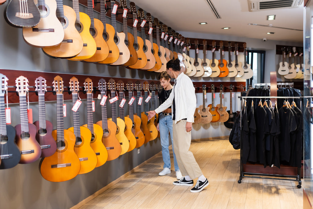 Acoustic guitars on showroom wall