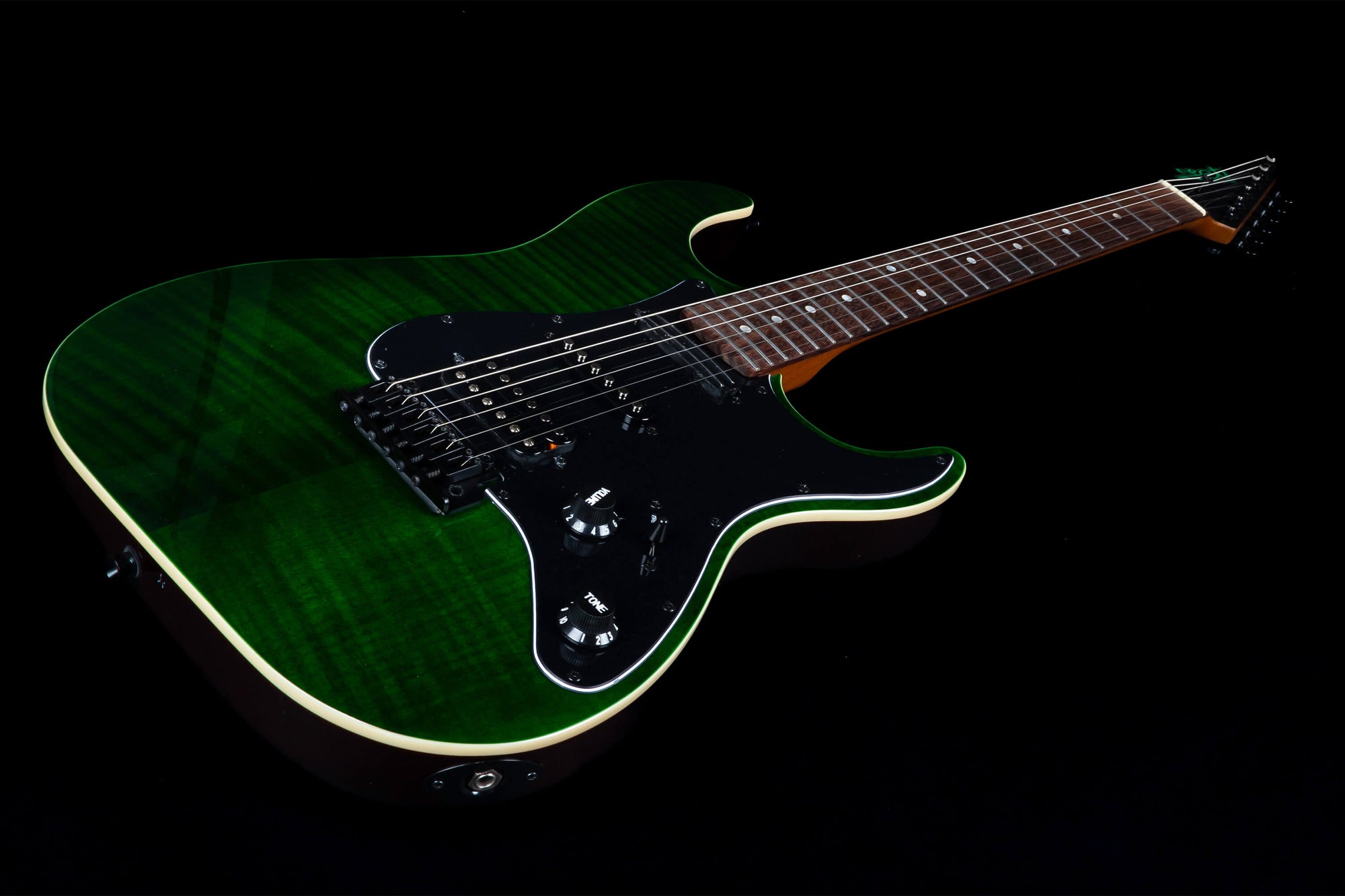 A green electric guitar made by Jet