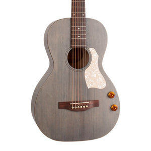 The Art & Lutherie Roadhouse Denim Blue Q-Discrete is a gray parlor acoustic guitar featuring six strings, a white pearloid pickguard, and two control knobs on the lower right side of the body. This travel-friendly guitar from Art & Lutherie boasts a stylish Roadhouse Denim Blue Q-Discrete finish, combining portability with eye-catching visual appeal.
