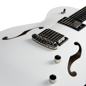 Close-up of a white Godin Rik Emmett Premiere Electric Guitar body by Godin, highlighting the f-holes, bridge, pickup, control knobs, and a portion of the fretboard on this limited edition model.