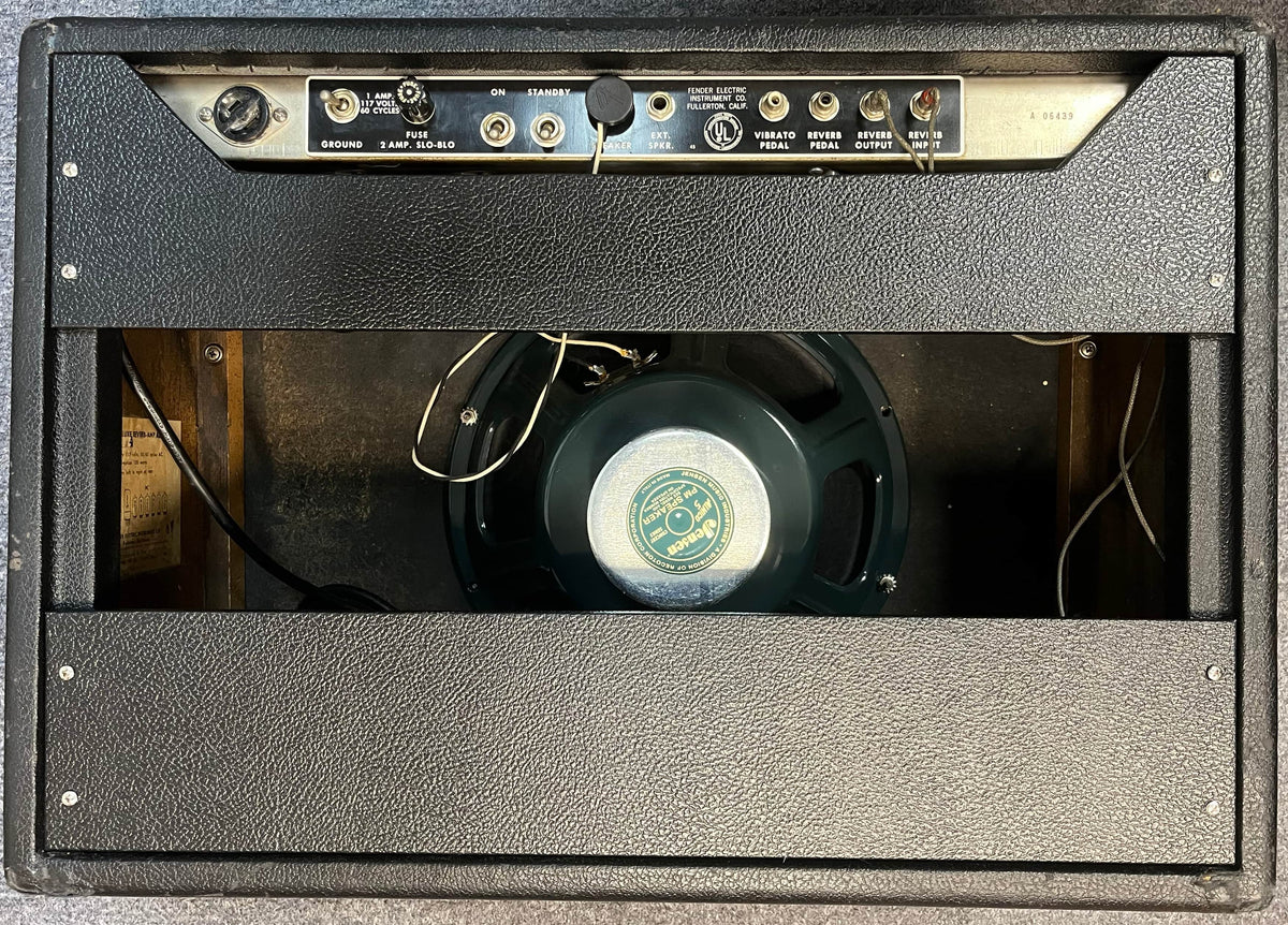 Rear view of a 1965 Fender Deluxe Reverb AB763 -- Pre-CBS Blackface (Serial A 06439), showing its control panel, input/output jacks, power cord, and exposed speaker inside the cabinet.