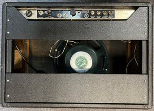 Rear view of a 1965 Fender Deluxe Reverb AB763 -- Pre-CBS Blackface (Serial A 06439), showing its control panel, input/output jacks, power cord, and exposed speaker inside the cabinet.