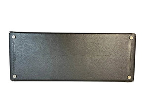 The Fender 1965 Deluxe Reverb AB763 (Pre-CBS Blackface, Serial A 06439) features a rectangular black textured design with four metal screws at each corner, echoing the iconic look of classic Fender amps against a white background.