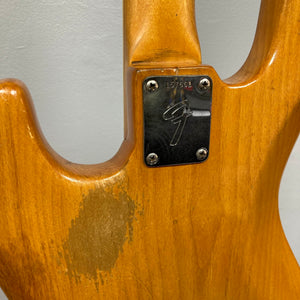 A close-up of the 1966 Fender Jazz Bass Natural Refinish w/Case shows a worn wood finish and a metal neck plate with the Fender "F" logo and serial number 137591.