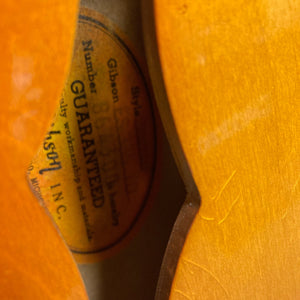 1967 Gibson ES-335 Sunburst guitar close-up, showcasing its vintage design and label details.