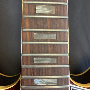 Close-up of the 1967 Gibson ES-335 Sunburst guitar neck and body, highlighting its vintage craftsmanship and semi-hollow design.