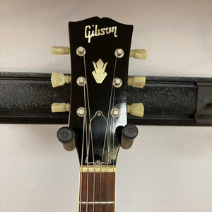 1967 Gibson ES-335 Sunburst guitar headstock and neck, featuring a logo and metal tuning pegs.