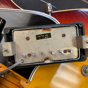 1967 Gibson ES-335 Sunburst electric guitar with visible vintage details and accompanying protective case.