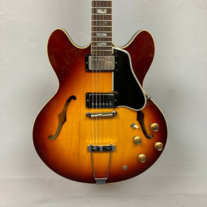 1967 Gibson ES-335 Sunburst guitar, close-up view showing strings and body details, highlighting its vintage charm and craftsmanship.