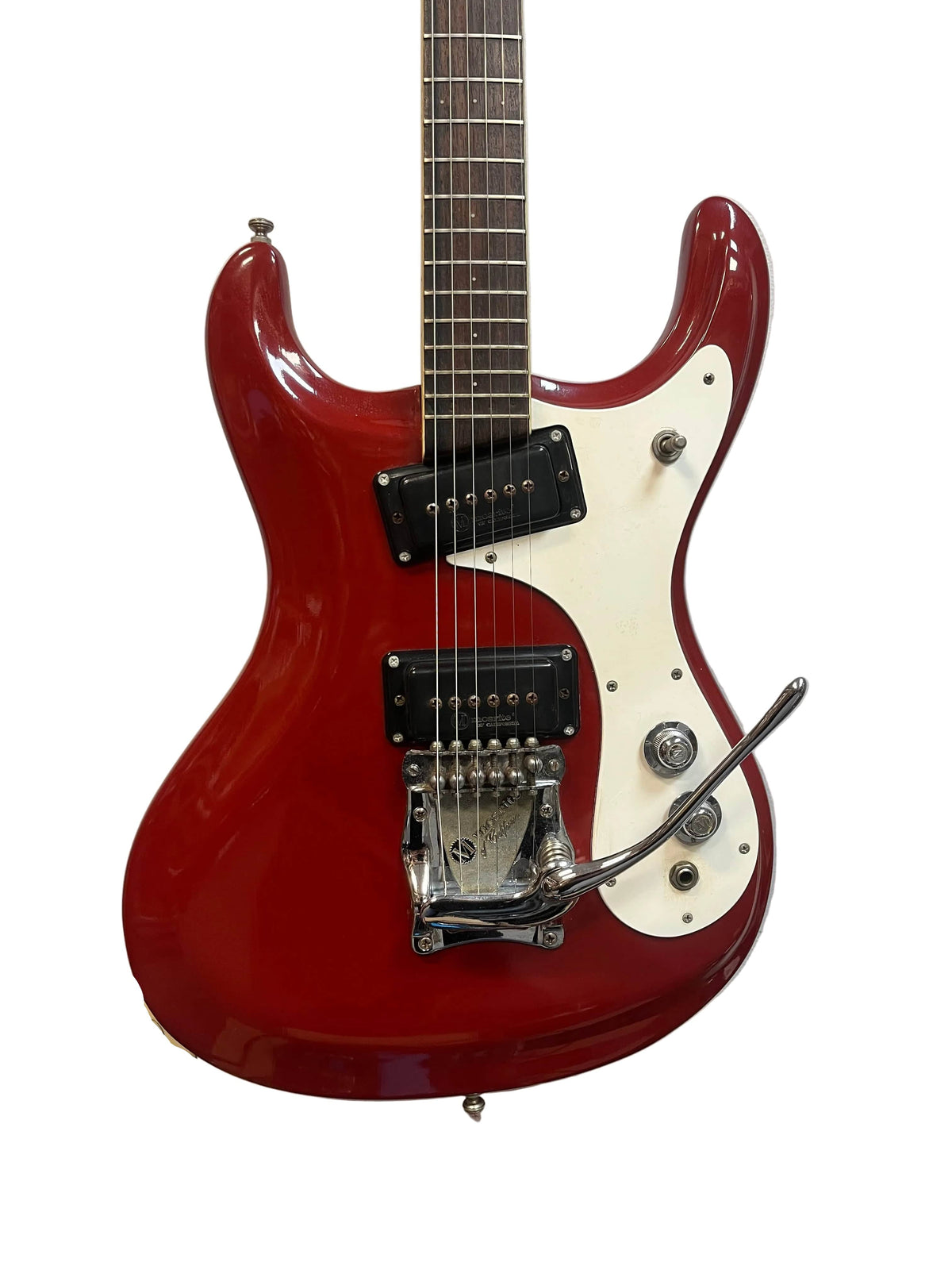 The Mosrite 1967 Mark I Vintage Guitar features a red finish, white pickguard, two black pickups, six strings, vibrato arm, and chrome hardware—an iconic Mosrite piece representing American guitar heritage. Photographed on a white background.
