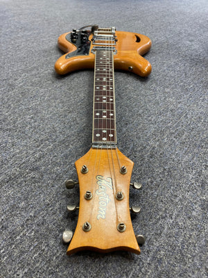 1968 Kustom K-200A Vintage Guitar with original case, featuring DeArmond Dyna-Sonic pickups and Bigsby vibrato, lying on a grey carpet.