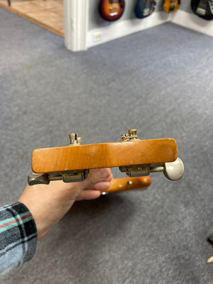 Person holding a 1968 Kustom K-200A vintage guitar with original case, showcasing classic design and features like DeArmond Dyna-Sonic pickups and Bigsby vibrato.