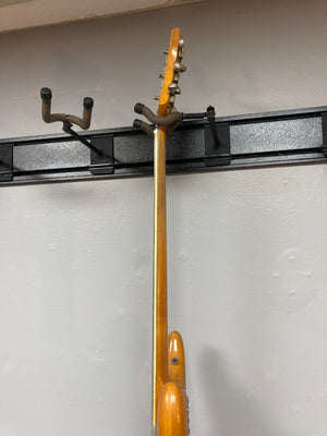 1968 Kustom K-200A Vintage Guitar w/OHSC displayed on a wall, featuring a wide headstock and Bigsby vibrato.