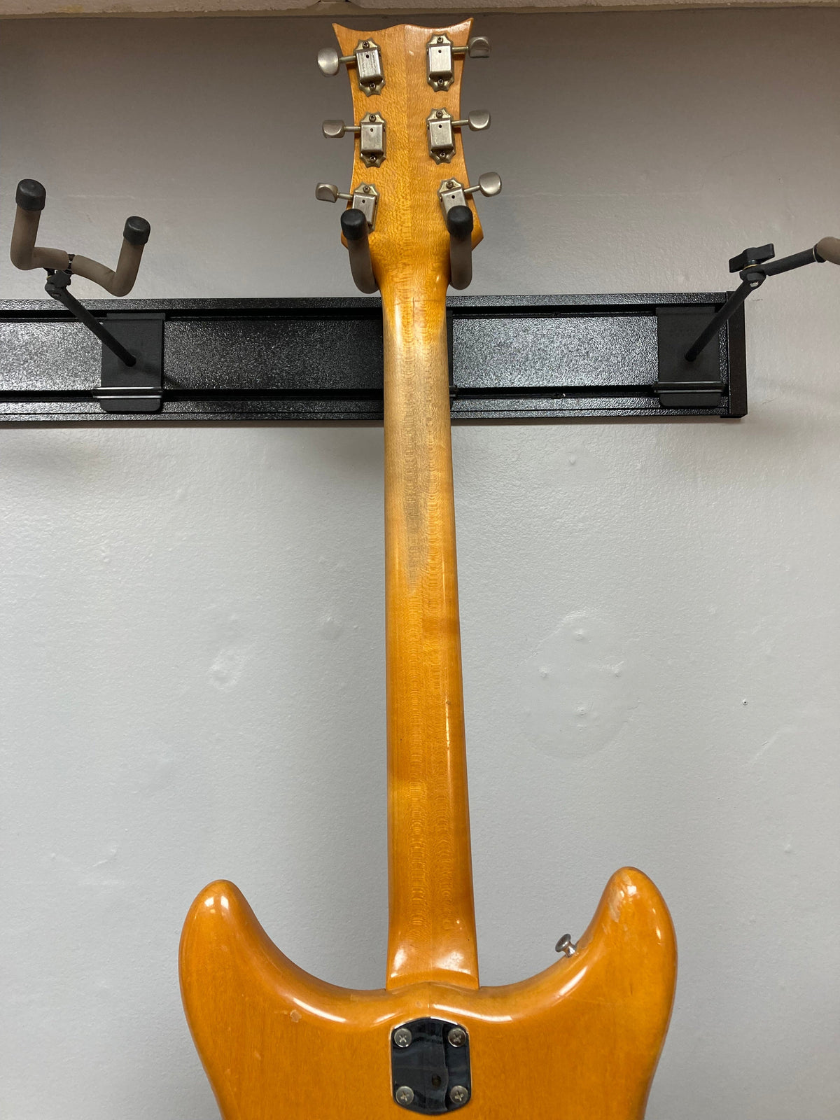 1968 Kustom K-200A Vintage Guitar on a stand, showcasing its wide headstock, DeArmond pickups, and Bigsby vibrato.