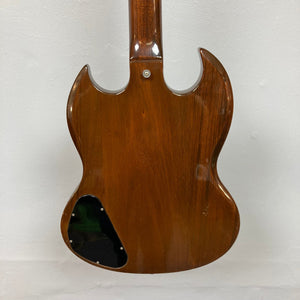 Close-up of a 1975 Gibson SG Standard Walnut guitar, showcasing its beveled Honduran Mahogany body and intricate fretboard inlays.