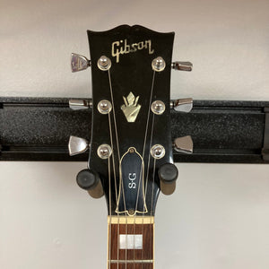 1975 Gibson SG Standard Walnut, close-up of headstock and neck, featuring Mother of Pearl inlays and chrome tuning machines.