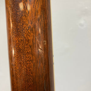 Close-up of the 1975 Gibson SG Standard Walnut guitar's wood grain and texture.