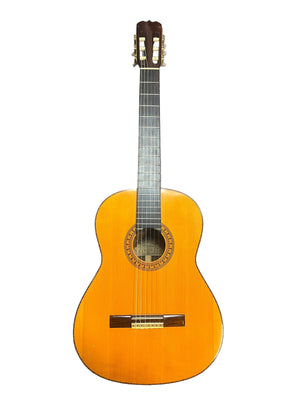A 1976 S. Yairi No. 880 classical guitar by S Yairi, made in Japan, featuring six strings, a Brazilian rosewood body, and a decorative rosette around the sound hole, displayed against a white background.