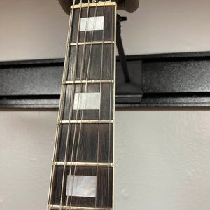 Close-up view of a guitar neck showing three rectangular mother-of-pearl inlays on a dark wood fretboard against a plain background, characteristic of the 1977 Gibson SG Standard Cherry w/Case by Gibson.