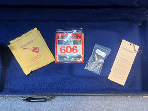 The 1978 Rickenbacker 4001 Bass — Fireglo (Serial RL7346) w/OHSC includes a Rickenbacker bass tag, polishing cloth, Superwound 606 strings, and tuning pegs in a blue plush case—ideal for vintage bass enthusiasts.