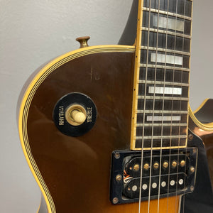 Close-up of the 1980 Gibson Les Paul Custom’s upper body, showcasing the rhythm/treble switch, strings, and fretboard in the iconic Tobacco Sunburst finish.
