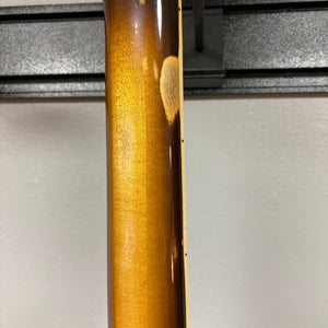Close-up of the back of a 1980 Gibson Les Paul Custom – Tobacco Sunburst w/OHSC by Gibson, showing a worn patch on the neck where the finish has faded to reveal lighter wood beneath—classic vintage character.