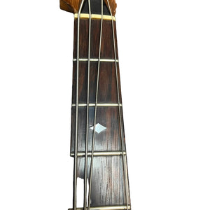 Close-up of a 1982 B.C. Rich Eagle Bass neck, USA made with original electronics and neck-through construction; features four metal strings, wooden fretboard, metal frets, and diamond inlay against a white background.
