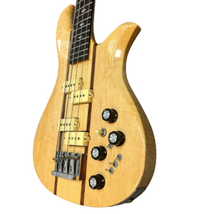 A 1982 B.C. Rich Eagle Bass, USA made with original electronics and four strings, features neck-through construction, dual pickups, four knobs, and a selector switch, shown on a white background. Professionally set up.