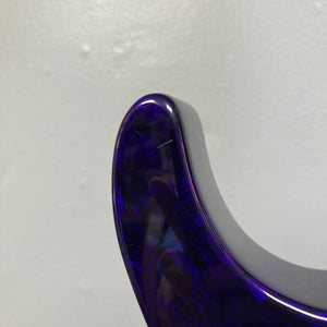 Close-up of the upper horn of a Jackson 1995 SL1 Soloist Custom Shop electric guitar in Eerie Dess Swirl finish, set against a plain light gray wall.