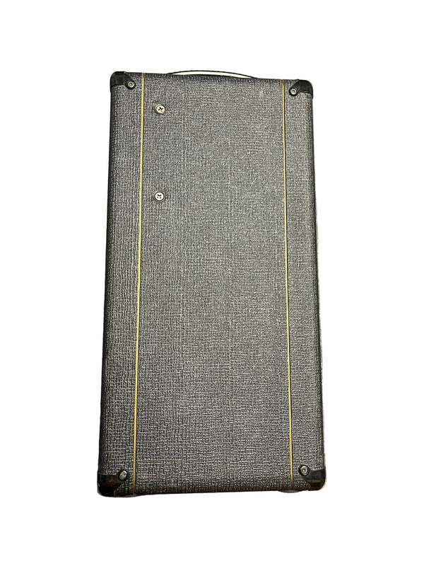 The 2004 Vox AC30/6TB, made in England, features a black control panel, gold VOX logo, brown diamond-pattern grille cloth, and legendary Celestion Alnico Blues speakers.