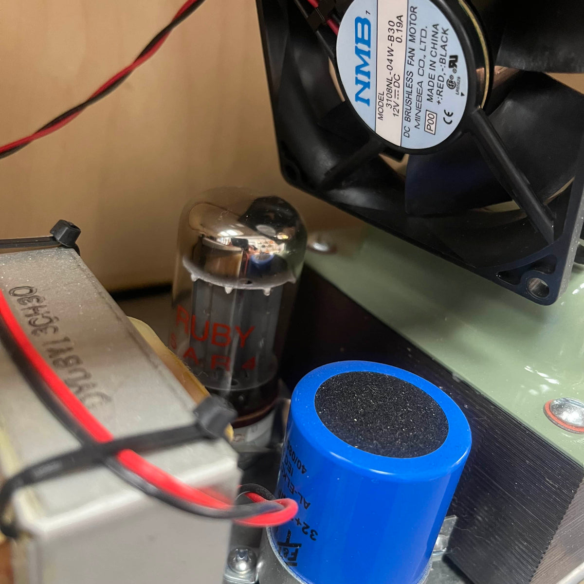 Close-up of electronic components including a fan .