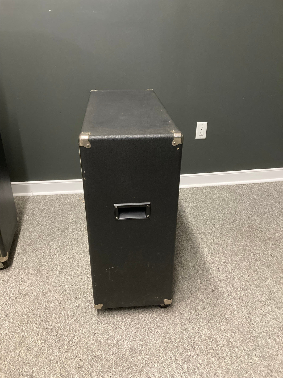 Used 4x12 speaker cabinet with handle and silver metal hinges, perfect for powerful sound and volume. Available for local pickup at Guitars on Main.