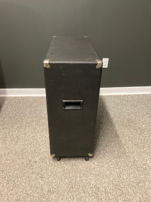 4x12 Speaker Cabinet Used on wheels, featuring a sturdy handle and silver corners. Ideal for delivering powerful sound and great tone. Available for local pickup.