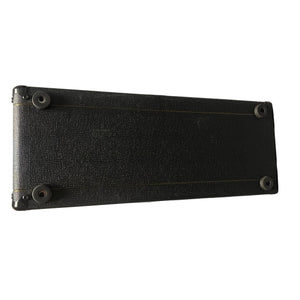 A rectangular black Vox case with textured surface, reinforced corners, and four rubber feet—made in England for the 2004 Vox AC30/6TB with Celestion Alnico Blues.