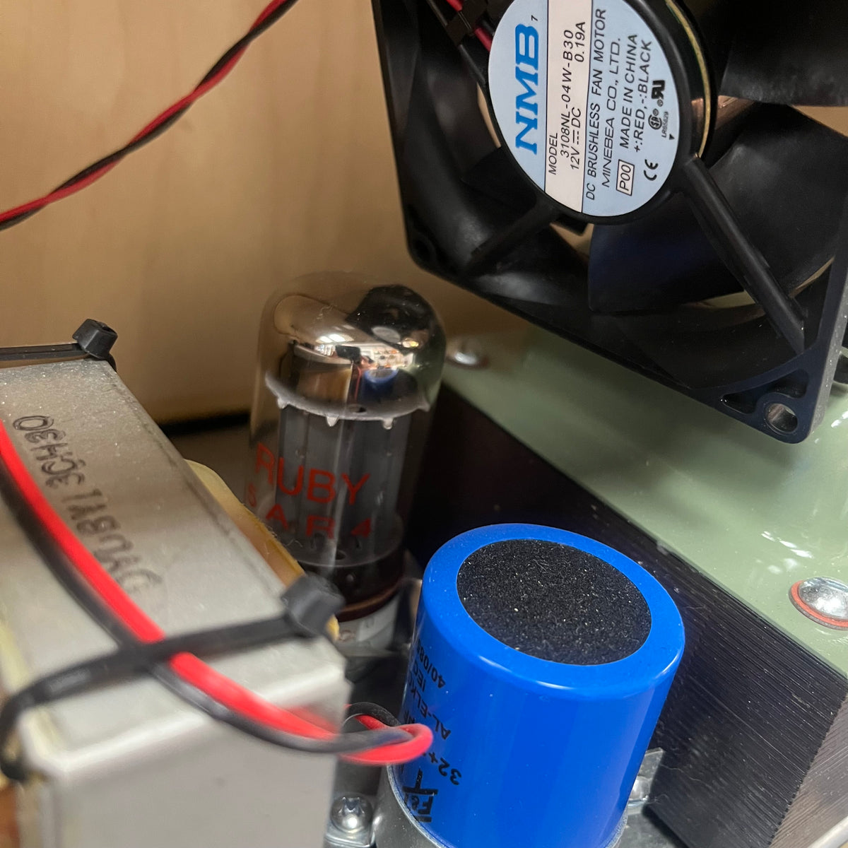 Close-up of electronic components including a fan .