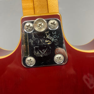 Close-up of a Vox 1967-68 Sidewinder IV Bass (V272) Cherry neck plate with serial number 396995, four screws, and a partially worn "SUPERMODERN" sticker.