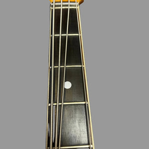 Close-up of a 1967-68 Vox Sidewinder IV Bass (V272) Cherry neck by Vox, showing four metal strings, fretboard, white fret marker, and frets against a plain gray background.