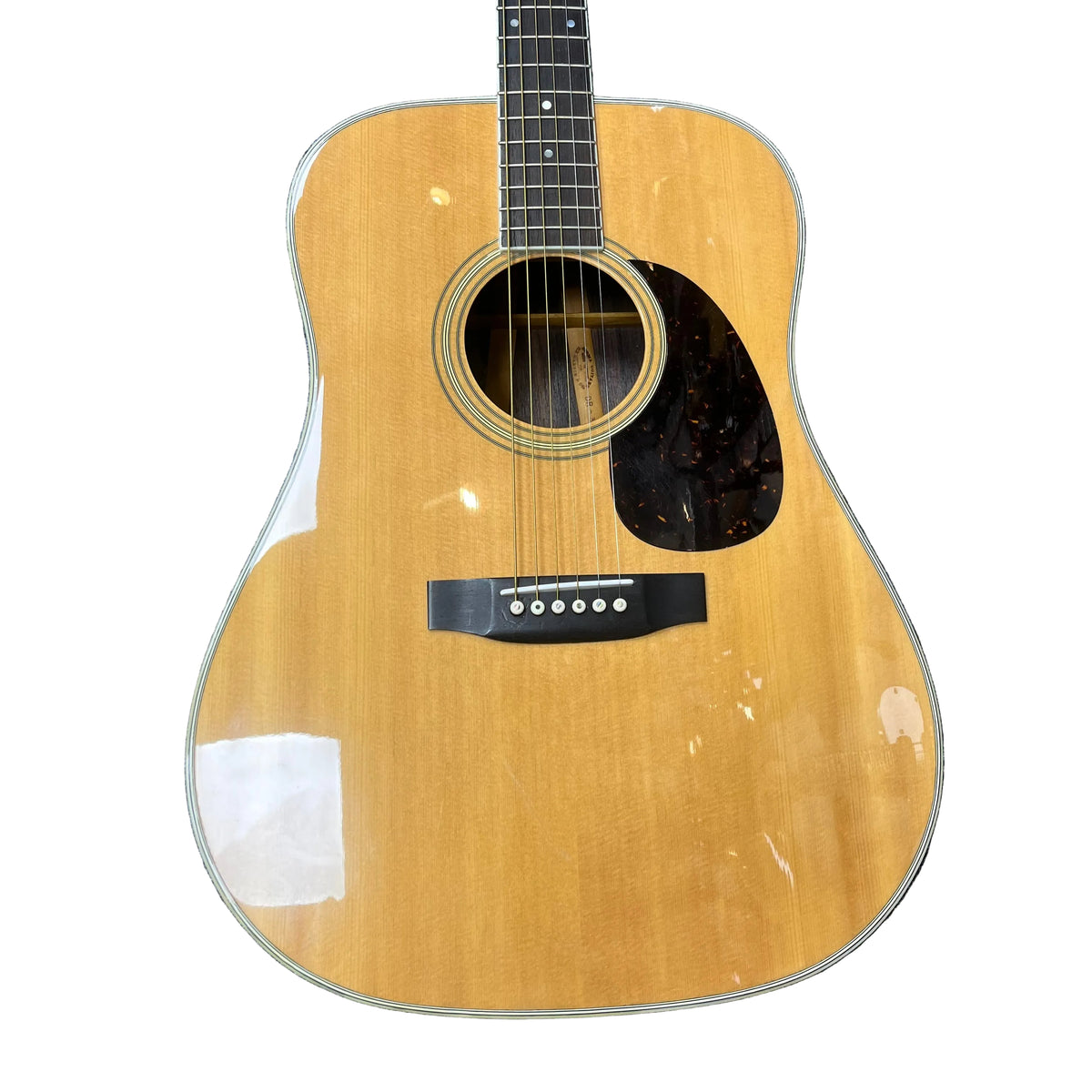 The Sigma Vintage DR-35 Acoustic Guitar, made in Japan, features a natural wood finish, black pickguard, six strings, and comes with a case. The lower part of this dreadnought is shown against a white background.