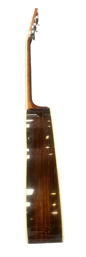 Side view of a Vintage Sigma DR-35 Acoustic Guitar w/case (Made in Japan) by Sigma, inspired by the Martin D-35, showing neck, tuning pegs, and glossy wooden body against a white background.